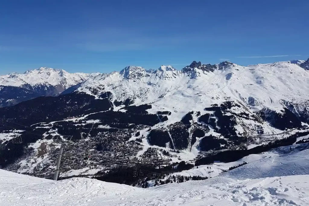 Luxury ski chalet exterior view in Méribel with mountain backdrop